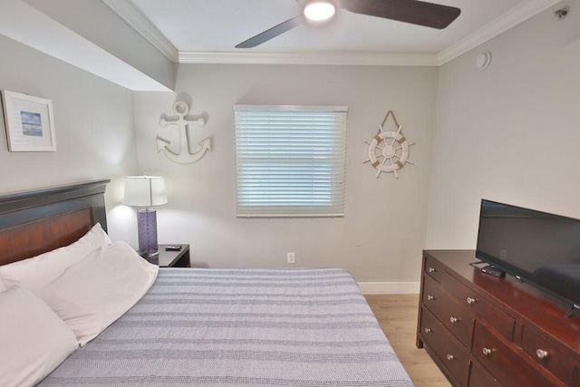 bedroom with crown molding, ceiling fan, and light wood-type flooring