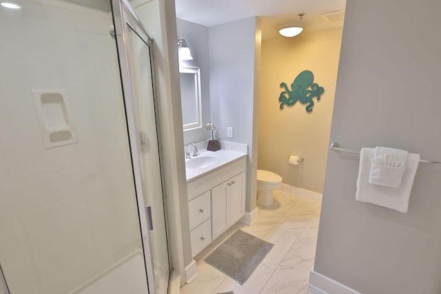 bathroom with a shower with door, vanity, and toilet