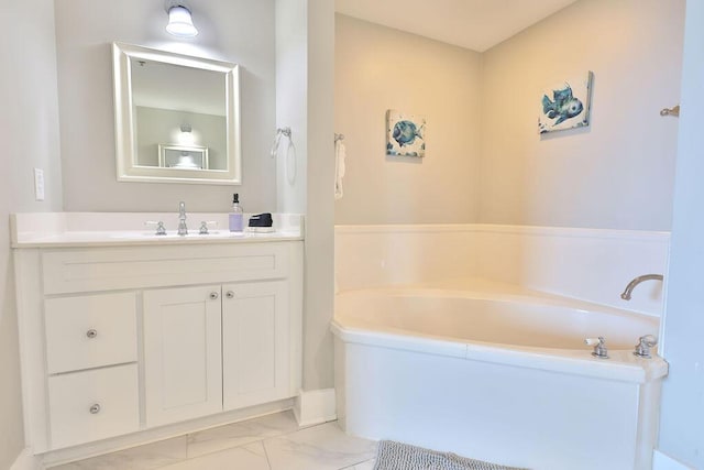 bathroom featuring vanity and a tub