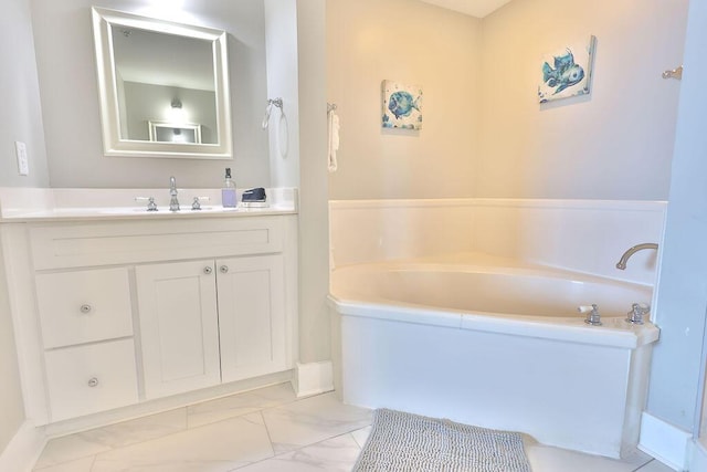 bathroom featuring vanity and a tub