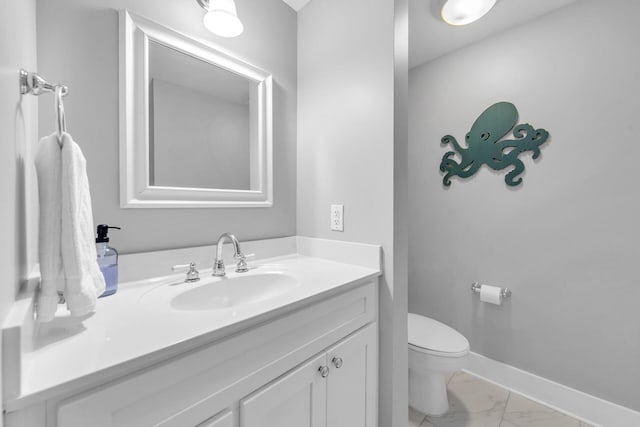 1110 Santa Rosa Blvd Unit C601, Fort Walton Beach, FL 32548 - bathroom with vanity, toilet, baseboards, and marble finish floor