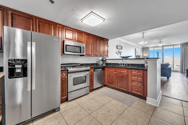 1110 Santa Rosa Blvd Unit C601, Fort Walton Beach, FL 32548 - kitchen with ceiling fan, light tile patterned floors, a peninsula, stainless steel appliances, and a sink