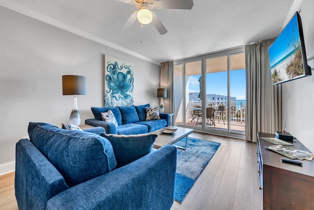 1110 Santa Rosa Blvd Unit C601, Fort Walton Beach, FL 32548 - living area with floor to ceiling windows, a textured ceiling, ceiling fan, and wood finished floors
