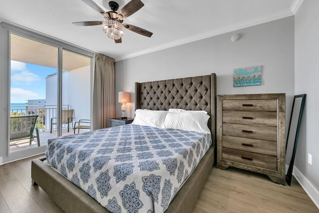 1110 Santa Rosa Blvd Unit C601, Fort Walton Beach, FL 32548 - bedroom featuring access to exterior, wood finished floors, and ornamental molding