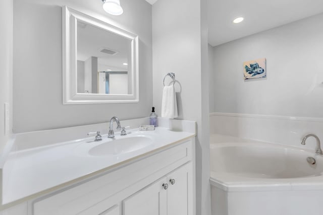 1110 Santa Rosa Blvd Unit C601, Fort Walton Beach, FL 32548 - bathroom featuring visible vents, a bath, and vanity