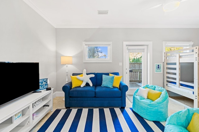 living room featuring crown molding