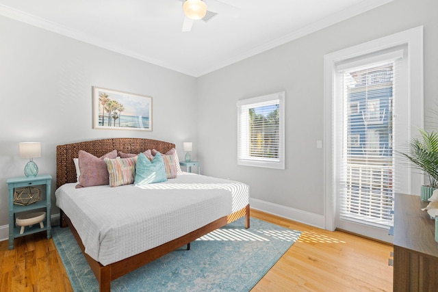 bedroom with crown molding, ceiling fan, access to exterior, and hardwood / wood-style floors