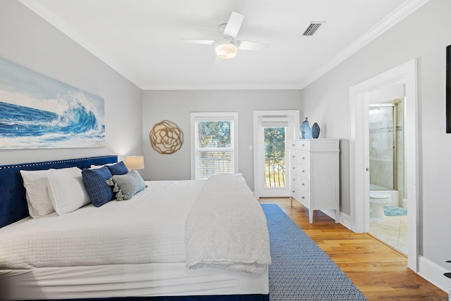 bedroom featuring crown molding, ensuite bath, access to exterior, and hardwood / wood-style floors