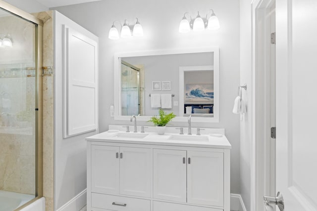 bathroom featuring vanity and bath / shower combo with glass door