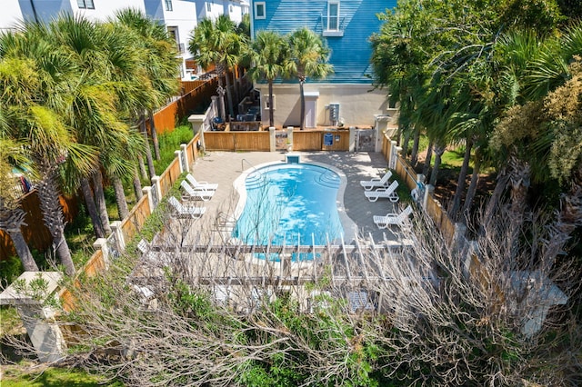 view of swimming pool featuring area for grilling and a patio