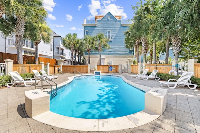 view of swimming pool featuring a patio