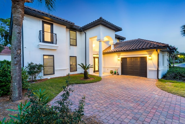 mediterranean / spanish-style home featuring a garage