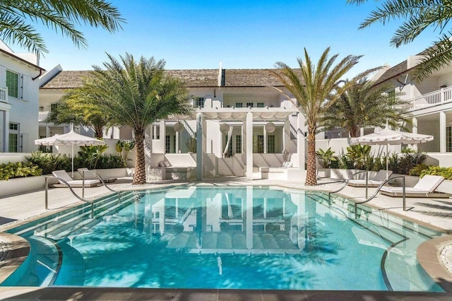 view of swimming pool featuring a pergola and a patio area