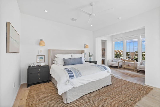 bedroom with ceiling fan and light wood-type flooring