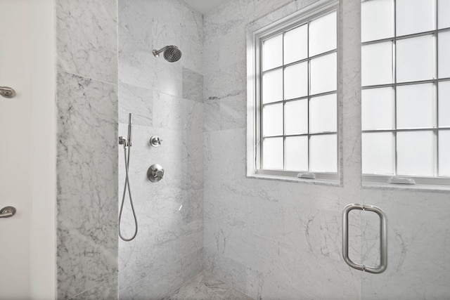 bathroom featuring a healthy amount of sunlight and an enclosed shower