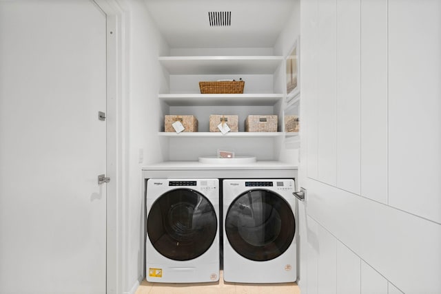 laundry area featuring separate washer and dryer