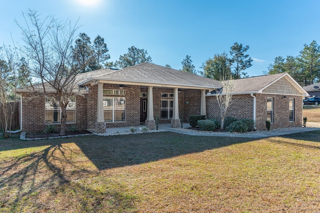 ranch-style home featuring a front yard