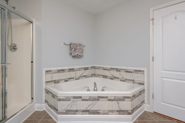 bathroom featuring tile patterned floors and shower with separate bathtub