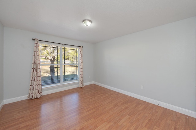 empty room with light wood-type flooring