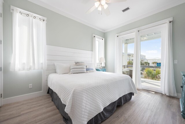 bedroom featuring ceiling fan, access to outside, and light hardwood / wood-style floors