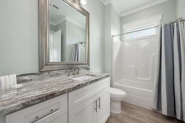 full bathroom with vanity, hardwood / wood-style floors, shower / tub combo with curtain, and toilet