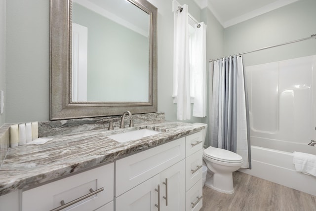 full bathroom with vanity, toilet, hardwood / wood-style floors, and shower / bath combo with shower curtain