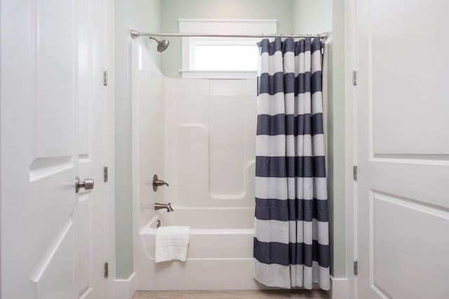 bathroom with shower / bath combo