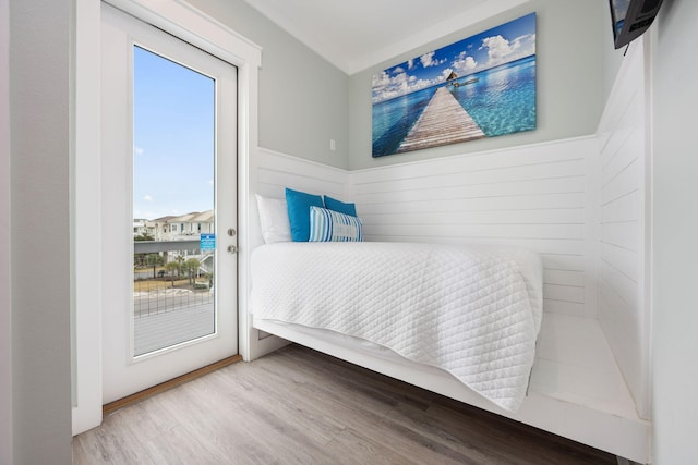 bedroom featuring hardwood / wood-style floors and access to exterior