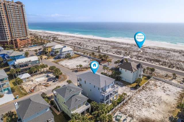 aerial view featuring a view of the beach and a water view