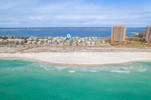 aerial view with a water view and a view of the beach