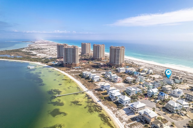 drone / aerial view featuring a view of the beach and a water view