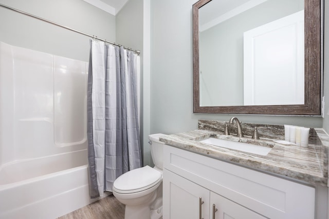 full bathroom with hardwood / wood-style flooring, vanity, shower / bathtub combination with curtain, and toilet