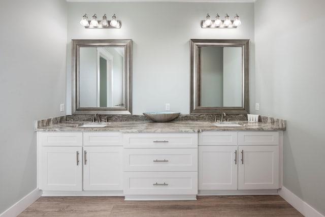 bathroom featuring vanity and wood-type flooring