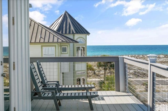 wooden deck featuring a water view