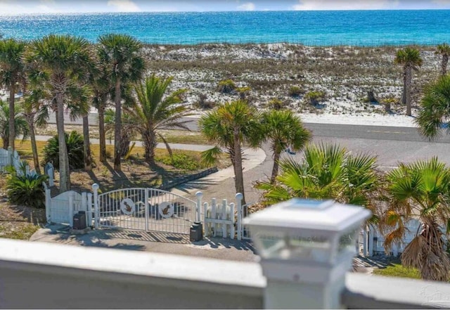 aerial view featuring a view of the beach and a water view