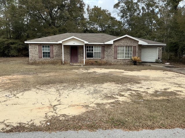 single story home featuring a garage