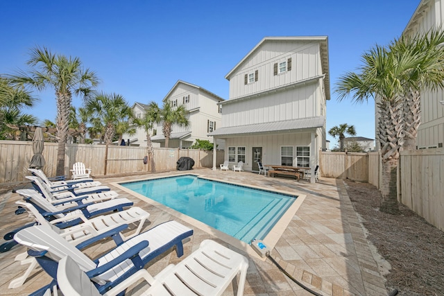 view of swimming pool featuring a patio