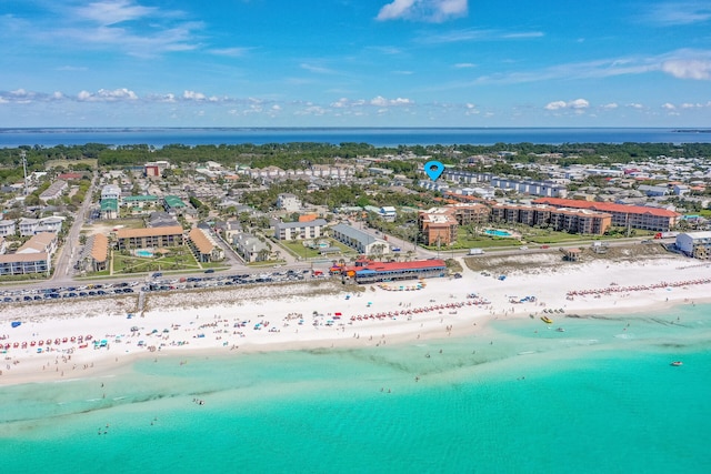 drone / aerial view with a beach view and a water view