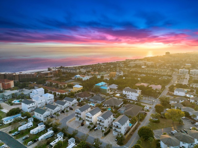 aerial view at dusk with a water view