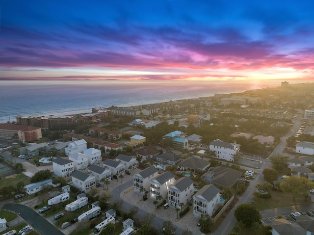 aerial view at dusk with a water view