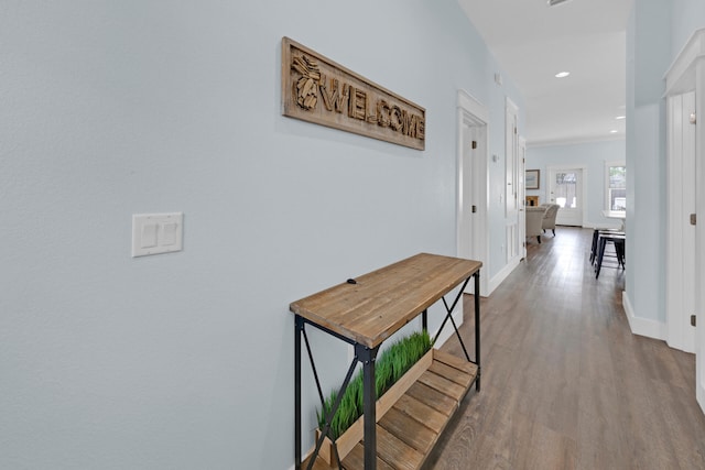 hallway with wood-type flooring