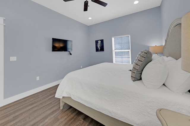 bedroom with ceiling fan and hardwood / wood-style floors