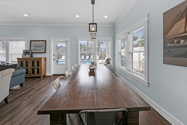 dining area with dark hardwood / wood-style flooring and ornamental molding