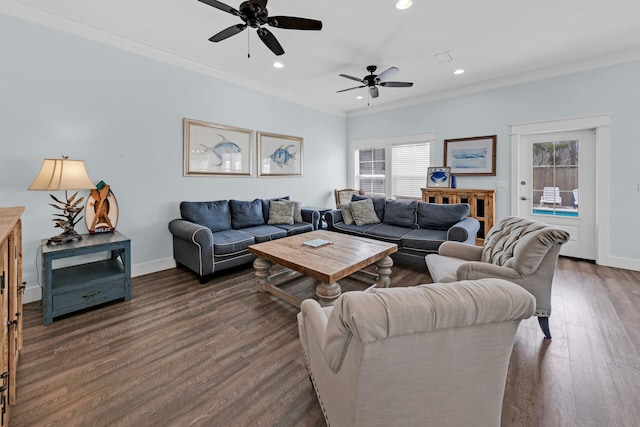 living room featuring crown molding, dark wood-type flooring, and ceiling fan