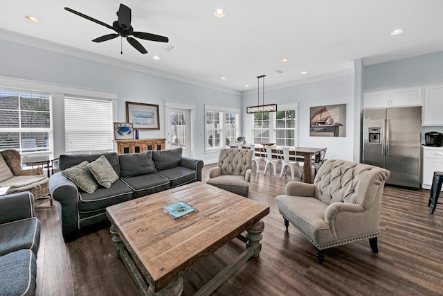 living room with crown molding, dark wood-type flooring, and ceiling fan