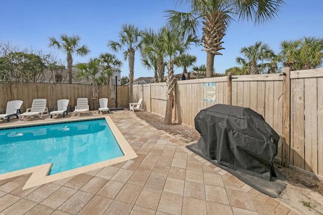 view of pool featuring a patio and area for grilling