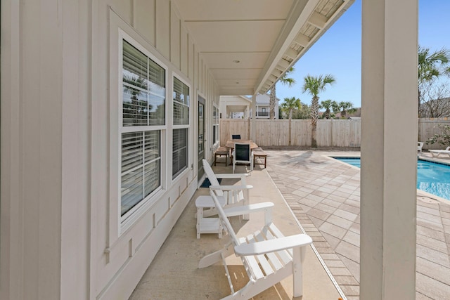 view of patio / terrace with a fenced in pool