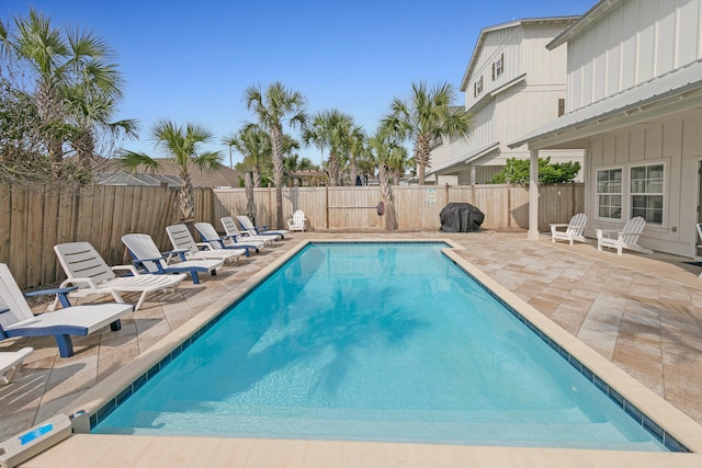 view of swimming pool with a patio