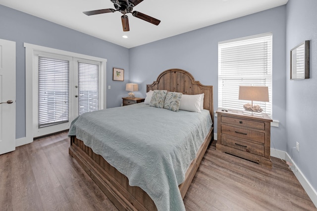 bedroom with ceiling fan, hardwood / wood-style floors, and access to outside