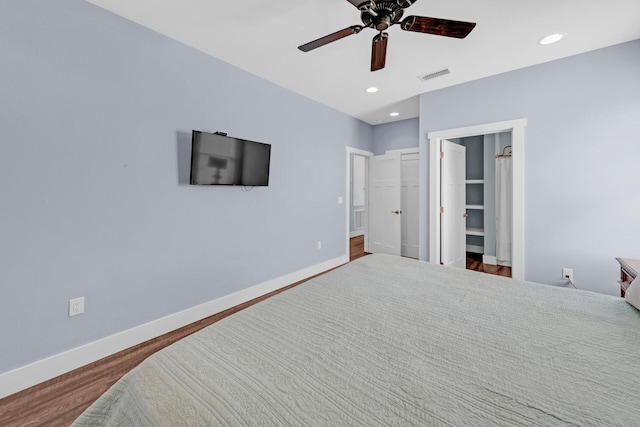 bedroom featuring wood-type flooring and ceiling fan